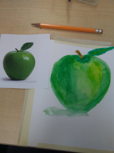 in this image my objective was to copy the image of the apple on the paper using the watercolor technique